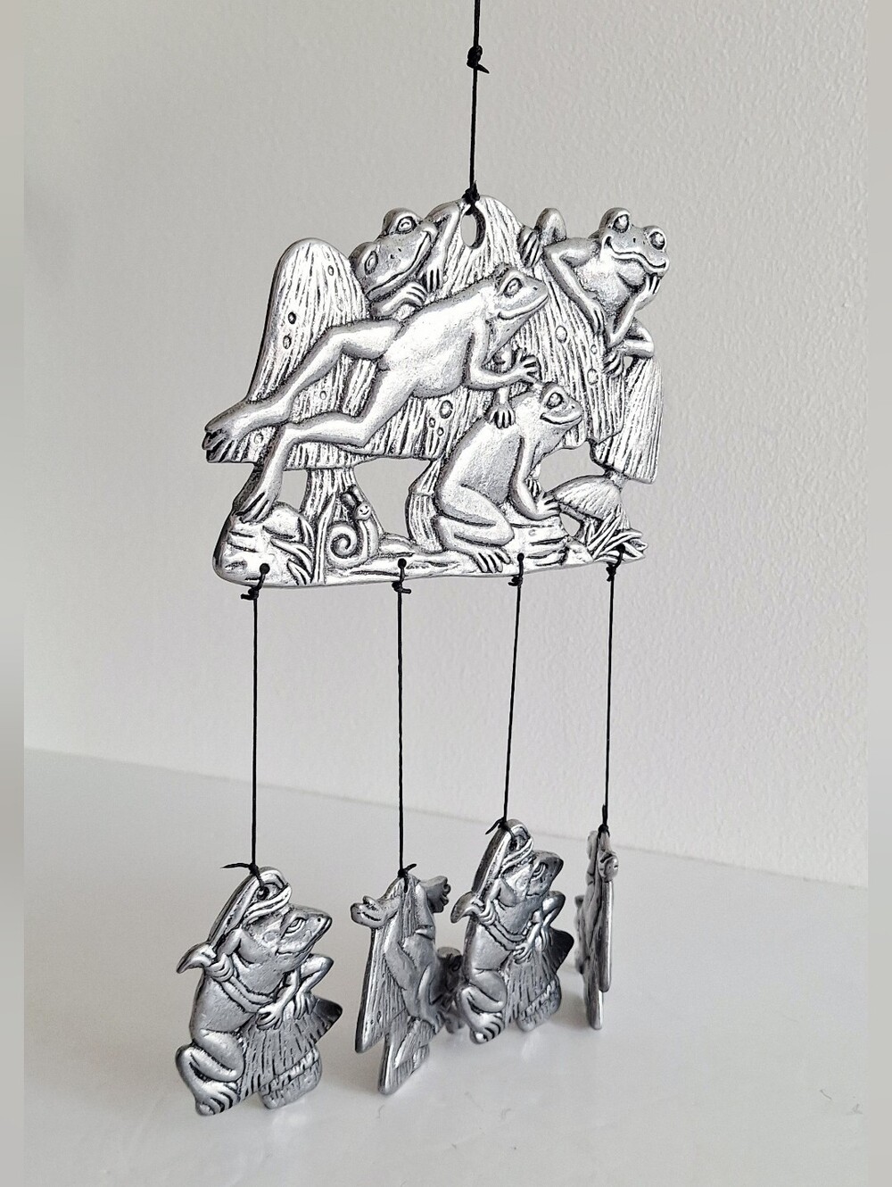 Tin frog figurine wind chime